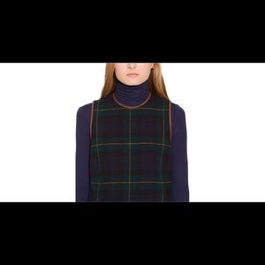 Polo sleeveless wool dress with leather trim.